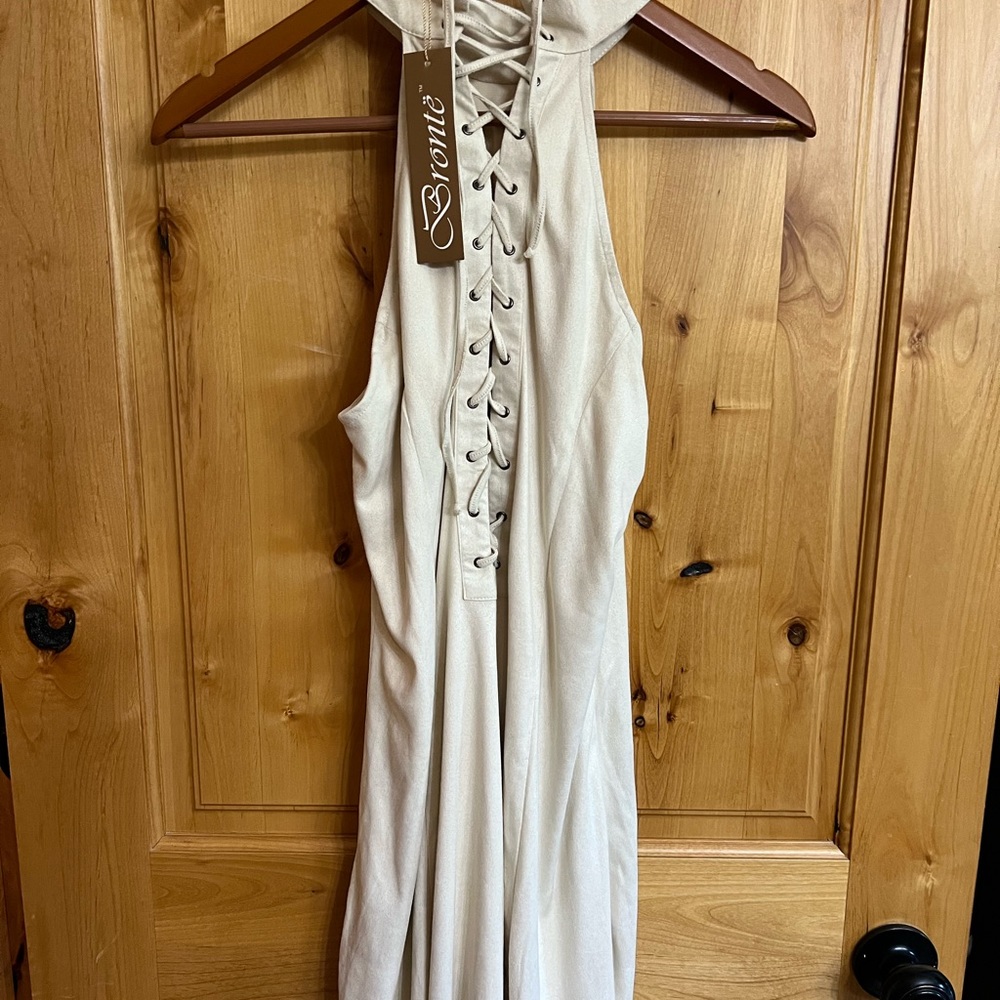 Bronte cream sleeveless dress. Material has a suede feel